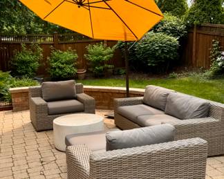Outdoor patio includes Crate & Barrel Wicker Patio Set and Copper Weber Grill with a Crate & Barrel Cantilever Umbrella