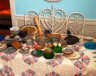 Nice quilts in this sale! Plus there is a day bed under all that glass!