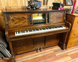player piano with a major collection of piano rolls!