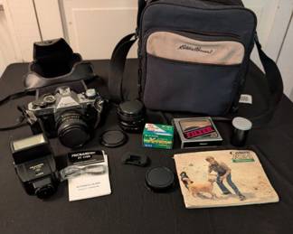 Vintage Canon AE-1 camera and accessories