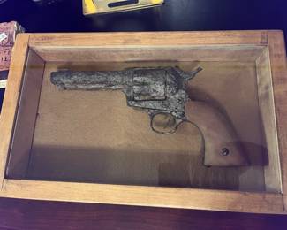 A rusted-up antique pistol for display