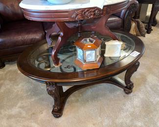Oval glass-top coffee table