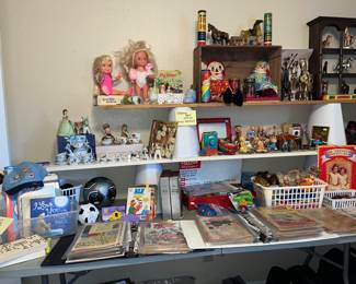 table full of toys & dolls