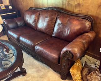 Let's start with this stately, wood trimmed LEATHER SOFA!