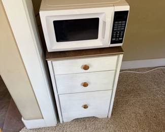 Microwave and small dresser
