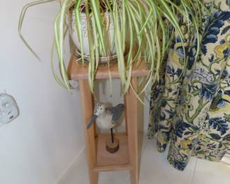 Plant stand, spider plant and wood sea gull.