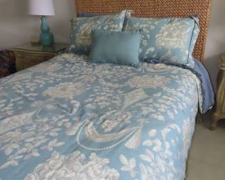 Full size bed with sea grass headboard.