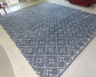 One of two matching area rugs.