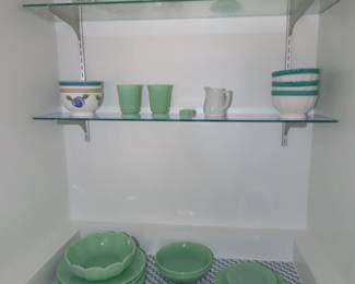 Jadite dishes, plates, mugs, cake stand and bowls.