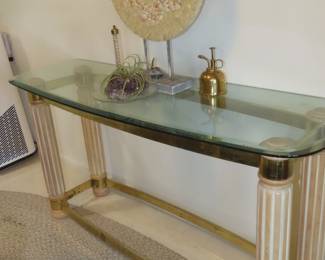 Glass and brass pillar sofa table.