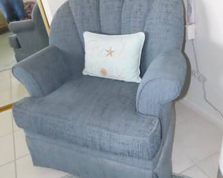 Soft fabric swivel armchair.