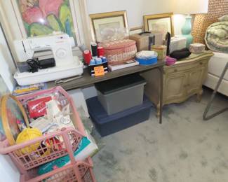Singer sewing machine, sewing notions, framed art, storage bins, buttons and sewing boxes.