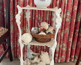 Metal elaborate shelf with cherub heads , shell collection
