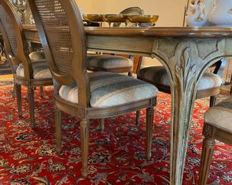 Dining Table with 6 cane back chairs , also notice the beautiful Persian Rug