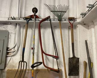 Garden tools shovels pic axe saw rakes