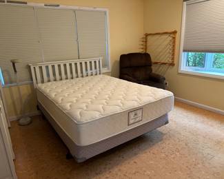 Queen size bed, lamp, and recliner