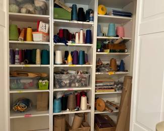 Weaving accessories including yarn, shuttles, and pattern books