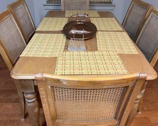 Beautiful dining table with cane back chairs