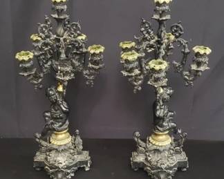 Pair of antique bronze cherub figural candelabras