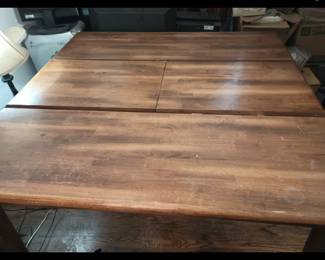 Wood table with fold in center extension, goes from large square, to rectangle. Includes nice matching wood bench.