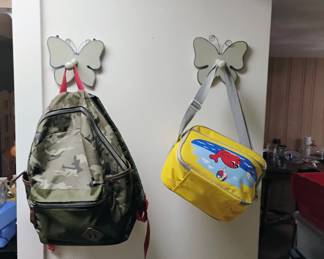 BACK PACKS AND WHALE IN YELLOW BAG