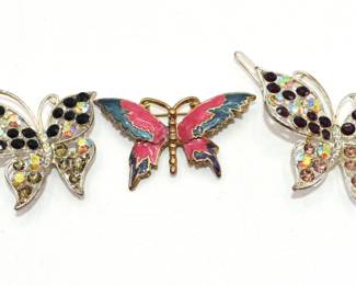 two butterfly barrettes and enamel butterfly pin/brooch