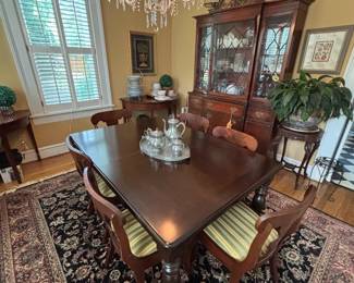 Nice dining room table, chairs, hutch and carpet along with so much more!