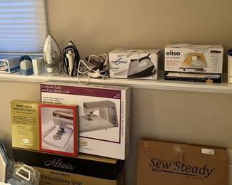 An iron for multiple purposes and various ironing board as well.
