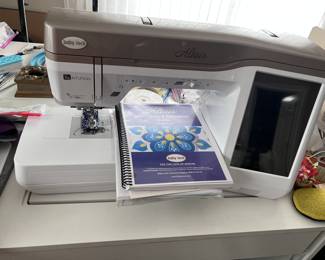 'Baby Lock' brand sewing center - complete set up requiring ample sewing space - perfect for the person who loves to sew and create unique masterpieces!