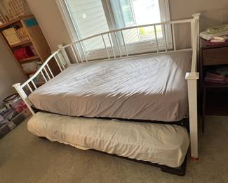 A trundle bed is PERFECT for guests and for kids overnights!