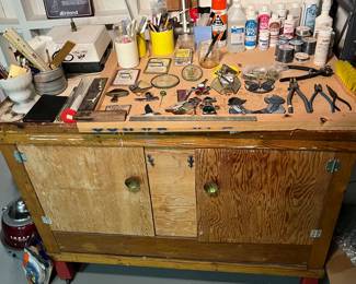 Vintage chest/workbench; stained glass and stained glass-making supplies.