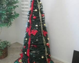 6' Kinkade Spruce Christmas Tree, Pre-Lit, Includes Trim & Skirt. (Folds Together and goes into the stand)