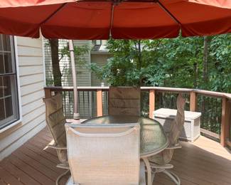 Outdoor glass top with metal base dining table, with 4 swivel/rocking chairs