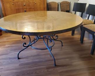 The table's diameter is 5'....and the table top is [COPPER] wrapped.  The base is wrought iron.