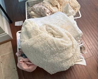 Lots of lace dollies, tablecloths
