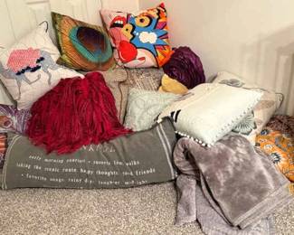 Piles Of Pillows And Blankets