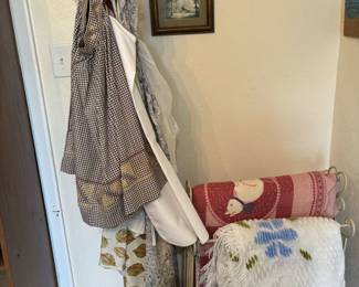 Aprons, quilts and quilt rack