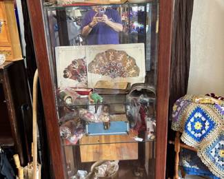 Display cabinet filled with vintage collectibles