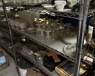 More clear glass drink glasses and oil cans and decorative pieces
