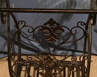 Metal Table with a Glass Top.