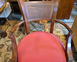 Large red cushion and vintage chair.