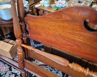 Full size bed with frame, rails, and slats.