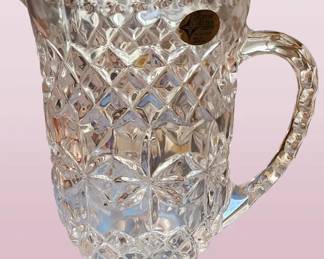 Clear crystal pitcher with a distinctive diamond-cut pattern . A vintage piece, possibly from the 1960s or 1980s.