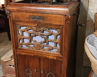 Victrola with records, record cleaners and replacement needles.