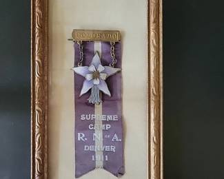 Enameled pin on 1911 ribbon