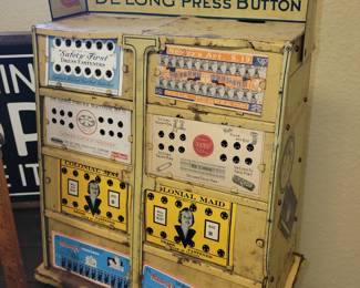 DeLong Press Buttons store display with product inside