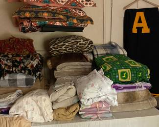 Wide assortment of blankets, throws, towels, sheets, placemats, cloth napkins, dresser scarves and more.