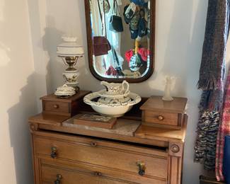 Beautiful antique dresser with marble inset, three antique wood trunks also in this bedroom.