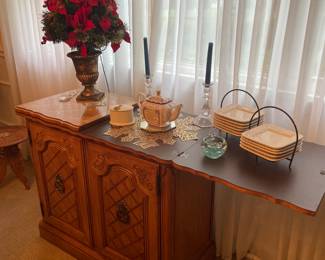This great server piece extends on both ends for all your entertainment needs. This piece matches the china cabinet.
