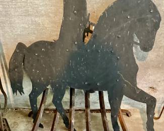 Fireplace grate and heavy metal horse and rider